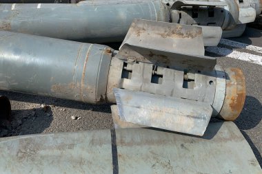 Wreckage from tail section of military missile used by Russian army to terrorize and destroy cities in Ukraine during invasion and war in 2022. Selective focus. Close up.