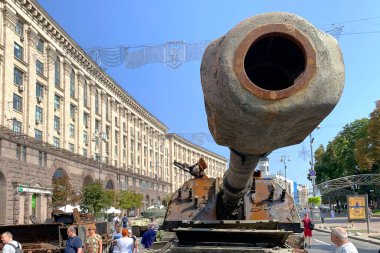 Kyiv, Ukraine, August 2022: - Russian battle tank knocked and destroyed during war Ukraine against Russian aggression are showing to people, on Khreshchatyk in Kyiv. Selective focus. Close up.