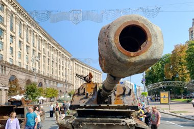 Kyiv, Ukraine, August 2022: - Russian battle tank knocked and destroyed during war Ukraine against Russian aggression are showing to people, on Khreshchatyk in Kyiv. Selective focus. Close up.