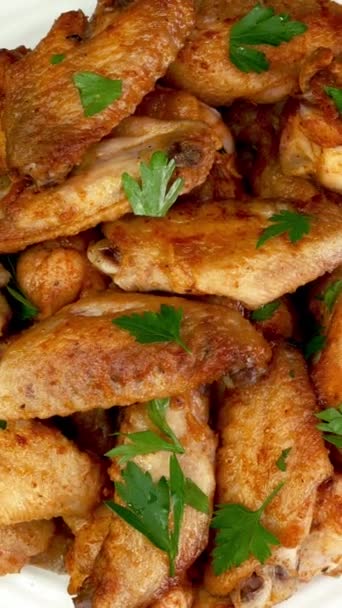 Many Fried Sprinkled Parsley Sliced Chicken Wings Rotate Slowly White — Stok video