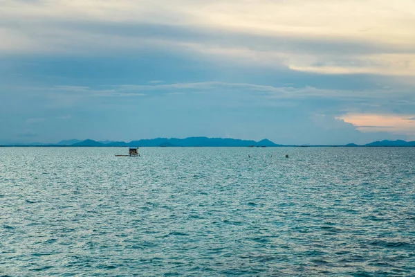 Aerial wide panorama of Bum Bum Island against an early morning blue sky colourful sunrise in Semporna, Borneo Sabah, Malaysia.