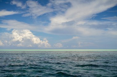 Three tones of sea under a beutiful sky. Dark blue and turquoise green in Semporna Islands, Borneo, Sabah. clipart