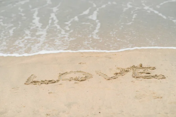 Love Written Sand Background Soft Waves Foam Ocean Sandy Beach — Stock Photo, Image