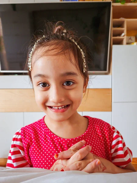 Portrait of young beautiful asian little girl wearing head accessories. 