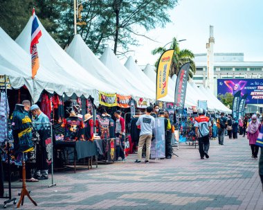 Terengganu, Malaysia - June 26, 2022 : People at the Bike Week event. Stall selling accesories.