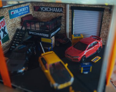 Perak, Malaysia - Aug 12, 2022 : Custom Model Car  in a workshop by Hot Wheels, diorama Made In Malaysia