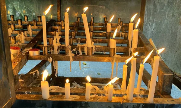Many Prayers Candle Flames Glowing Dark Create Spiritual Atmosphere —  Fotos de Stock