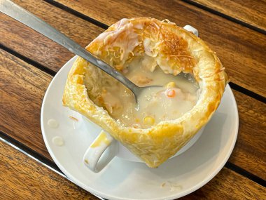Zuppa toscana or bread or Tuscan or Minestra Pane or Zuppa soup. Made from kale, zucchini, beans, potatoes, celery, carrots, onion, tomato pulp, extra virgin olive oil, chili and chicken or bacon.