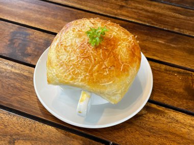 Zuppa toscana or bread or Tuscan or Minestra Pane or Zuppa soup. Made from kale, zucchini, beans, potatoes, celery, carrots, onion, tomato pulp, extra virgin olive oil, chili and chicken or bacon.