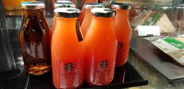 Surakarta, Central Java, Indonesia, 02 August 2022, Starbucks Orange Juice, mix fruit juice and apple juice inside the display fridge