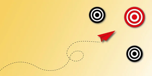 Red paper plane hitting in the red target centre on yellow background as metaphor for business target or goal success and winner, success concepts. shadow overlay. copy space. paper art design style.