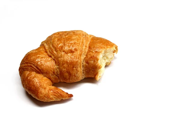 The bitten croissant isolated on the white background