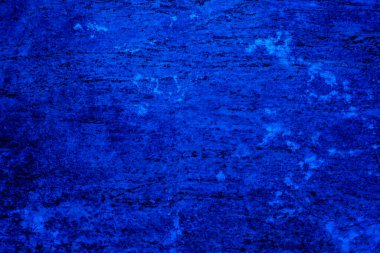 Koyu mavi beton duvar yüzeyi. Çatı katı tarzı duvar. Eski çimento arka planı. Tasarım için bir kopya alanı var.