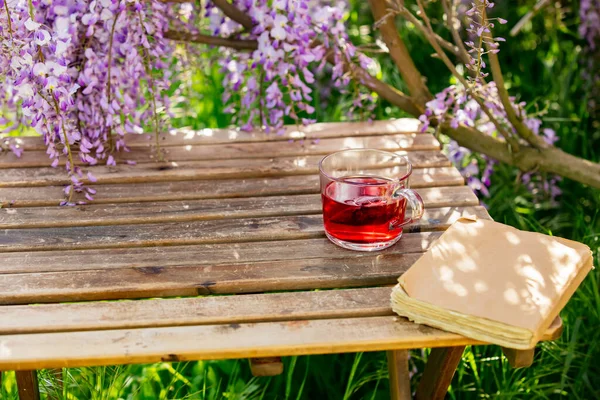 Cup Tea Old Book Wooden Table Next Wisteria Tree Garden — Stock Photo, Image