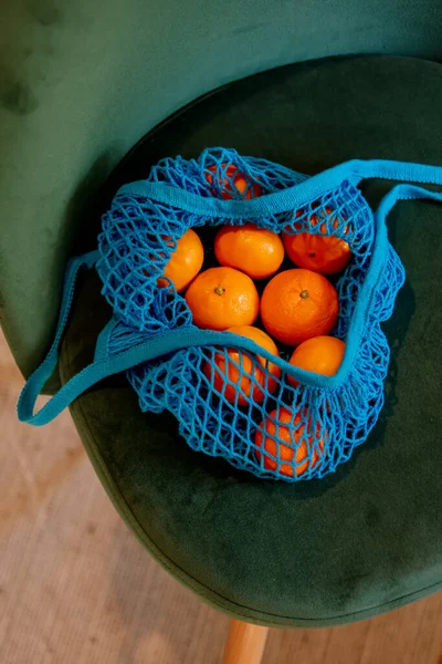 Mandarins Blue Net Bag Green Chair —  Fotos de Stock