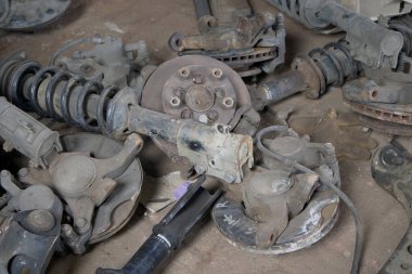 Brake pads and other used car parts as garbage