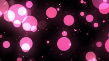 Güzel yüzen pembe parçacıklar parlayan bokeh baloncukları kusursuz döngü hareketli arka plan ışıkları. Siyah arkaplan üzerindeki pembe parçacık kaplama ya da hareketli başlıklar sinematik zemin döngüsü olarak kullanılabilir.