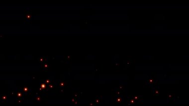 Parlak turuncu ateş parçacıklarından oluşan kusursuz bir döngü, yükselen parçacık tozunun kıvılcımları, siyah arka planda gelişigüzel akan sıcak kıvılcımlar yakıyor. Sinematik görüntülerinizi kaplamak için.. 