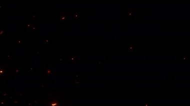 Soyut, dikişsiz, yükselen kül kıvılcımları projenizi örtbas etmek için kullanılabilir. 4K 3D kaotik hareket ateşli turuncu parlayan kor yanan kül parçacıkları.