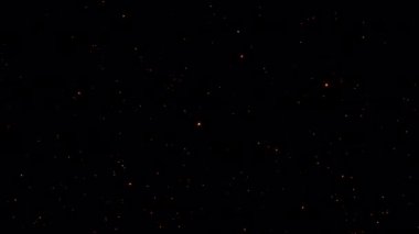 Flow up Fire particles sparks rising up on black background 4K 3D animation of fiery orange glowing flying ember burning ash particles.Rendering isolated transparent with  quicktime alpha channel prores 4444 effect element.  