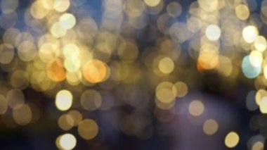 Altın Led Işığı 'ndan Altın Bokeh' e. Soldan sağa hareket ediyor. Soyut Festivalsel Arkaplan İçin.