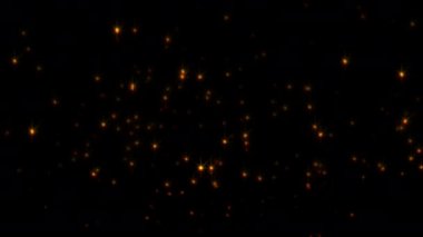 Işıl ışıl parlayan turuncu ateş parçacıkları siyah arka planda yükselen kıvılcımlar. 4K 3D ateşli turuncu parlayan kor parçacıkları yanan kül parçacıkları animasyonu..