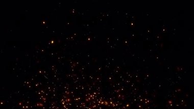 Fire particles sparks rising up on black background with transparent alpha channel can be used for overlay for your project. 4K 3D animation of fiery orange glowing flying ember burning ash particles.