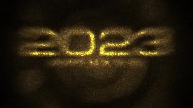 2023 Happy New Year Golden shimmering particles text with gold Bokeh cinematic lights 4K 3D animation. 2021 Happy New Year footage for overlaying to your video. Golden colored bokeh abstract party celebration.