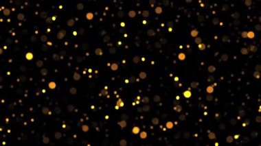Ekran projesi için siyah zemin üzerinde turuncu bokeh parçacıkları parlıyor. Kış Noel 'i için yeni yıl temalı 4K kusursuz döngü