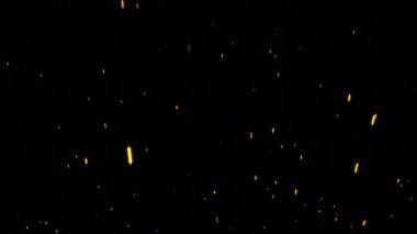 Soyut parlak turuncu ateş parçacıkları siyah arkaplanda akıyor. Grafik hareket canlandırma döngüsü alfa kanalı Prores 444 ile izole edildi .