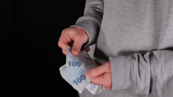 Counting turkish lira, man counting Turkish liras with his hand — Stockvideo