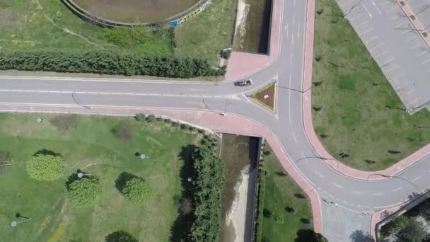 Aerial road junction and vehicle — Vídeos de Stock