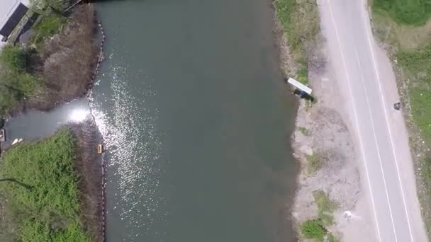 Aerial creek and bridge — стоковое видео