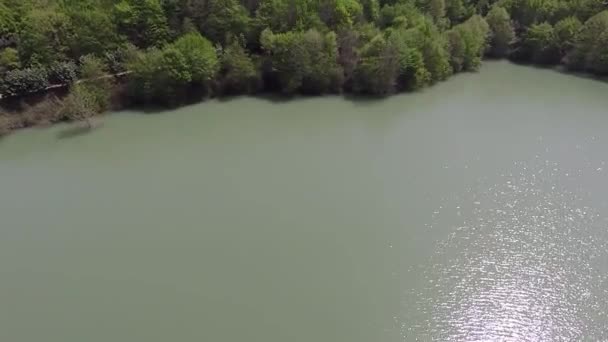 Aerial greenish turquoise lake — Stock videók
