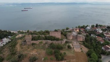 medieval castle, aerial old medieval castle by sea and new city