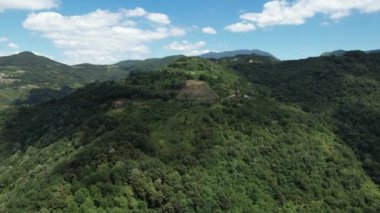 green mountains, aerial green mountains and blue cloudy sky