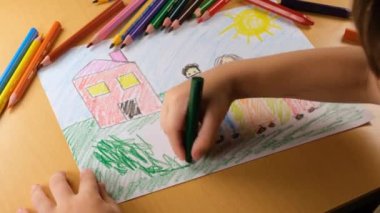 child draws pictures, child draws and paints family and home pictures