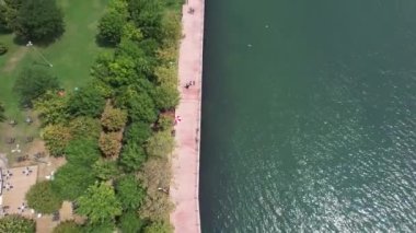 pedestrian path, aerial pedestrian path by the sea and people walking