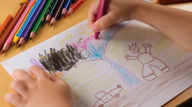 kid painting, preschool age kid painting picture with colorful pens