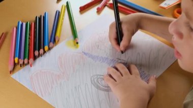 drawing on paper, boy drawing on paper with colorful pens