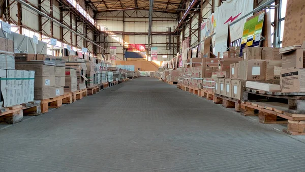 Industrial warehouse with tiles and sanitary ware, huge warehouse, hangar, pallets with products