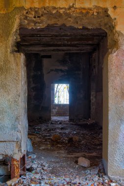 The inner room of the abandoned building of the former restaurant on the top of Mount Akhun in sunny autumn day, Sochi, Russia