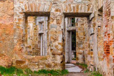 The inner room with gaps in the wall of the abandoned old mansion called Dacha Kvitko, Sochi, Russia