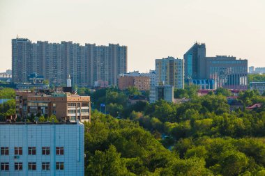 Aerial view of buildings and parks of the Tyumen City in sunny summer day, Russia