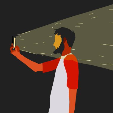 Sakallı bir adam akıllı telefonu elinde tutuyor ve selfie çekiyor.