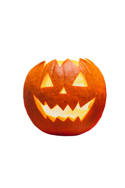 Isolated smiling, scary, carved Halloween pumpkin on white