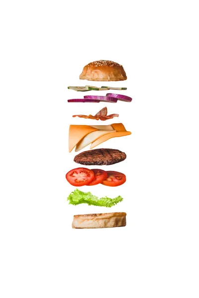 Heerlijke Burger Hamburger Met Vliegende Ingrediënten Geïsoleerd Wit Png Stockfoto