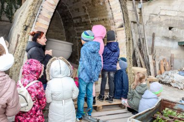 excursion of schoolchildren to the pottery workshop - oven for firing products