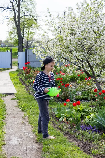 Boy Barefoot Cap Watering Flowers Spring Garden Green Watering Can —  Fotos de Stock