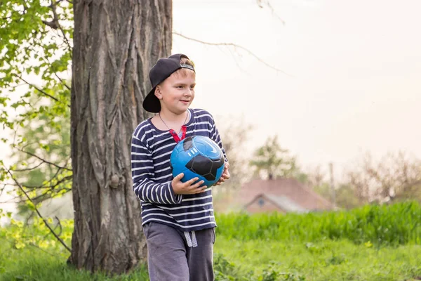 Boy Outdoors Ball Playing Football Grass Spring Village —  Fotos de Stock
